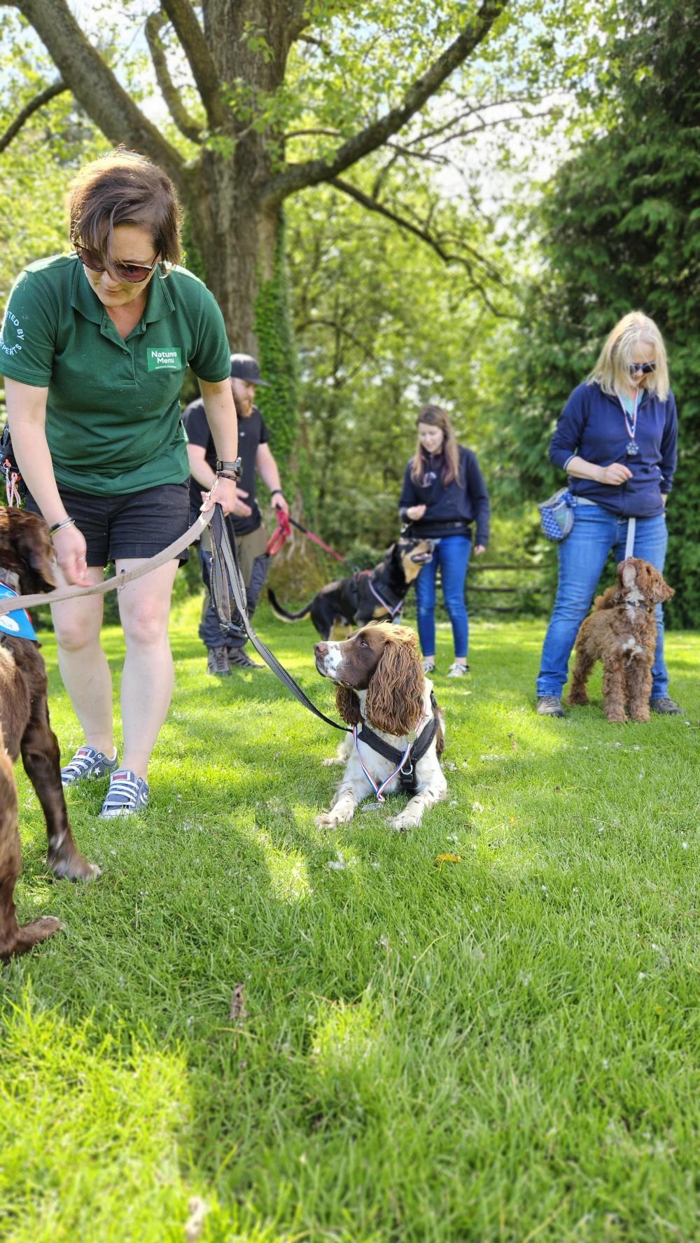 Mel from Natures Menu with dogs at conference