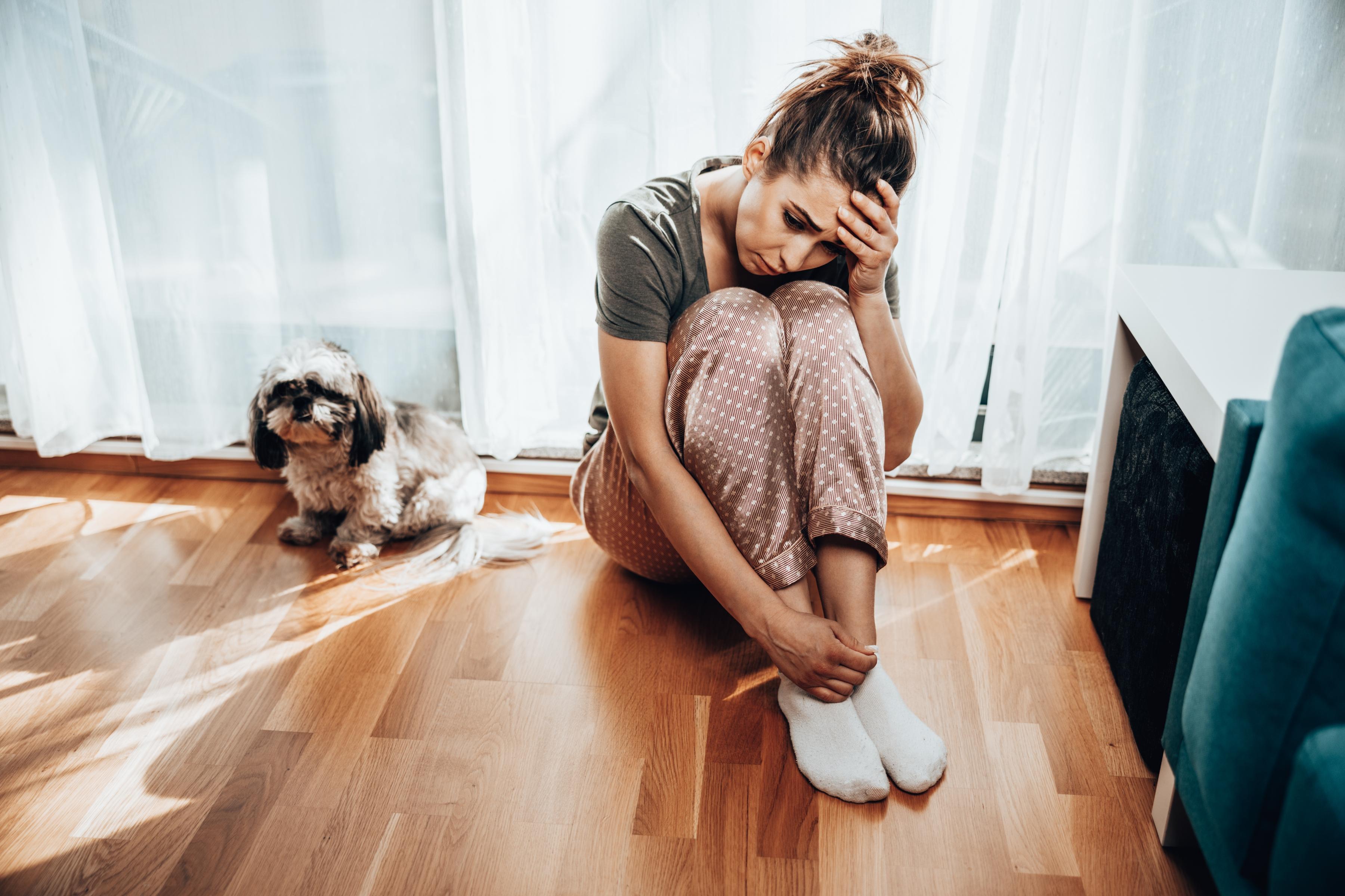 Women sitting worried with puppy blues